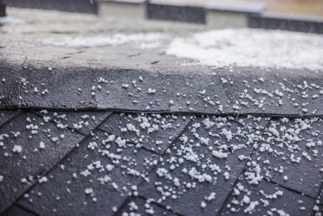 Small hailstones on shingle roof.