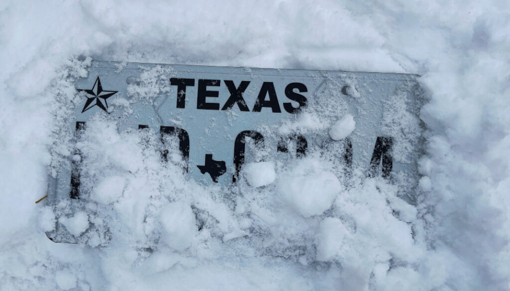 Texas license plate buried in snow
