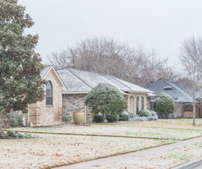 an image of texas homes covered in ice, sleet, and snow