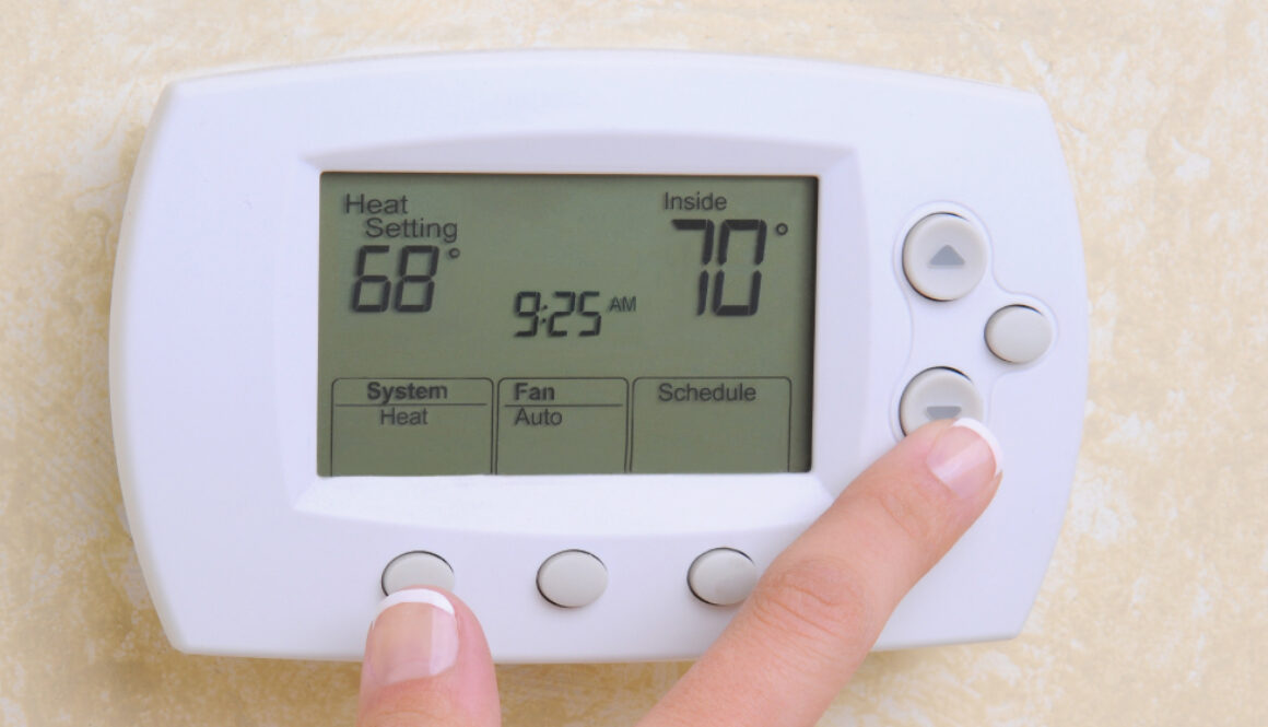 An image of a air conditioners thermostat on the wall